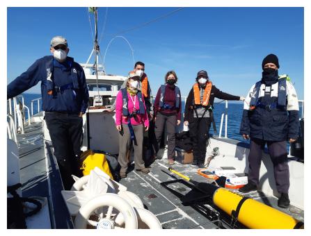 Foto di gruppo di ricercatori impegnati nell'esperimento AMBO